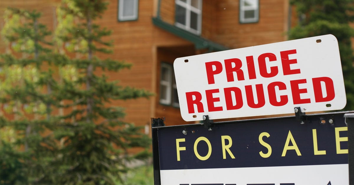 A For Sale - Price Reduced sign in front of a home showing that the housing market may be slowing down.