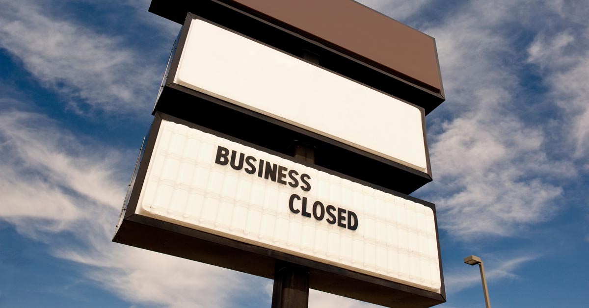 A large sign displaying the words "Business Closed."
